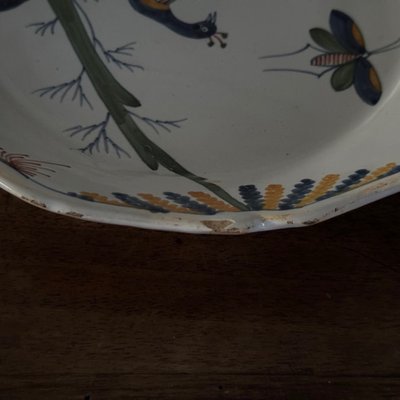 18th century La Rochelle earthenware plate with peacock and butterfly design