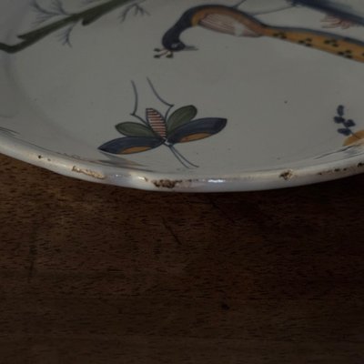 18th century La Rochelle earthenware plate with peacock and butterfly design