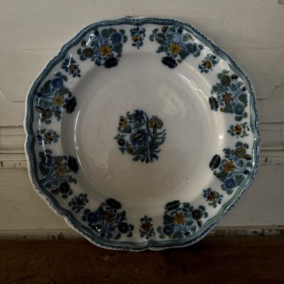 Plate in 18th century Moustiers earthenware with floral design