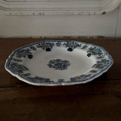 Plate in 18th century Moustiers earthenware with floral design