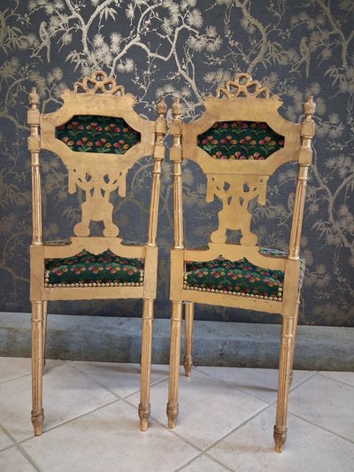 Coppia di sedie in legno dorato stile Luigi XVI XIX