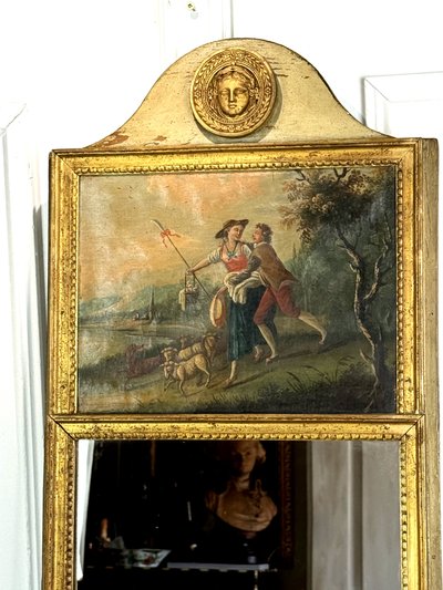 19th CENTURY EMPIRE STYLE LAMQUED AND GILDED WOOD TRUMP WITH A SHEPHERD DECORATIVE