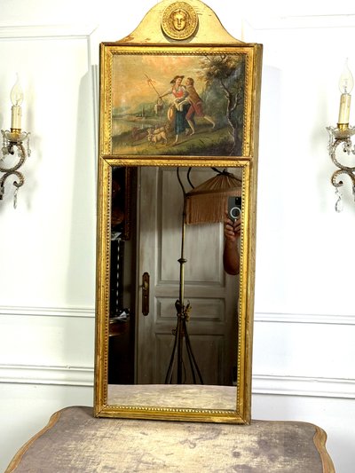 19th CENTURY EMPIRE STYLE LAMQUED AND GILDED WOOD TRUMP WITH A SHEPHERD DECORATIVE