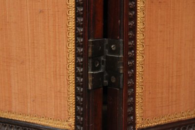 - Louis XVI-style four-leaf folding screen in carved and mahogany-stained beech. Work