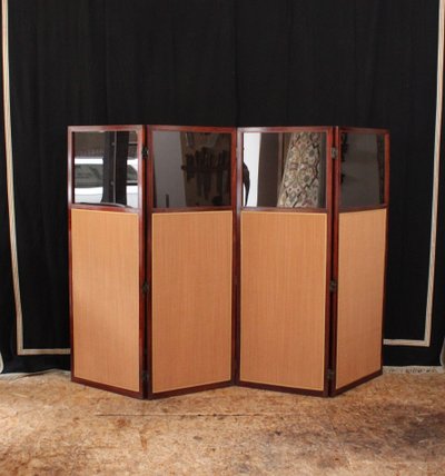 - Louis XVI-style four-leaf folding screen in carved and mahogany-stained beech. Work