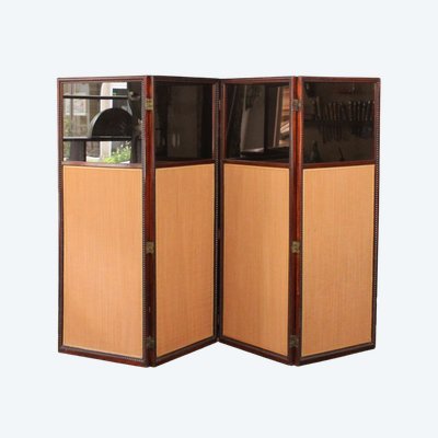 - Louis XVI-style four-leaf folding screen in carved and mahogany-stained beech. Work