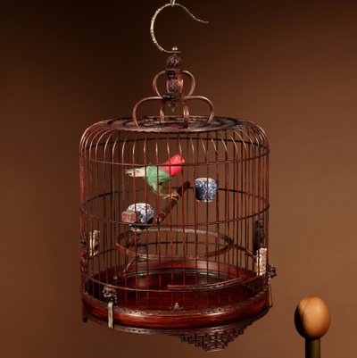 Chinese birdcage in finely carved bamboo.