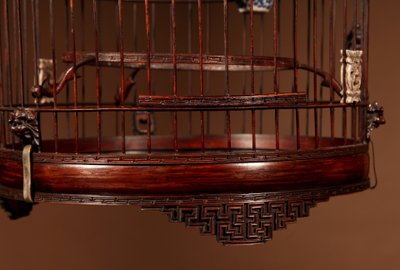 Chinese birdcage in finely carved bamboo.