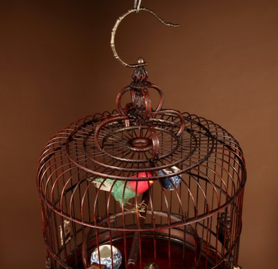 Chinese birdcage in finely carved bamboo.