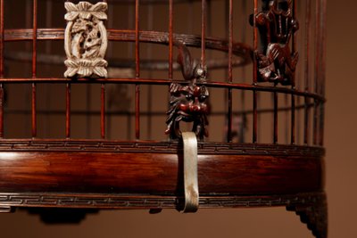 Chinese birdcage in finely carved bamboo.