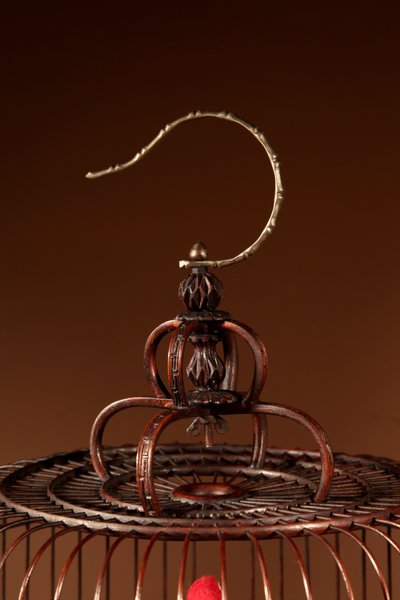 Chinese birdcage in finely carved bamboo.