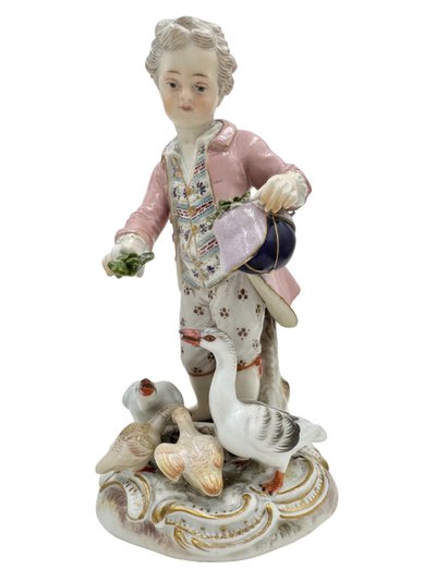 Meissen porcelain figurine Boy feeding geese.