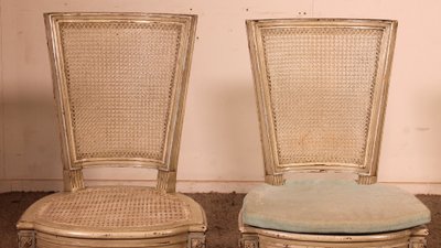 suite de 12 chaises de style Louis XVI en bois polychrome -19° siècle