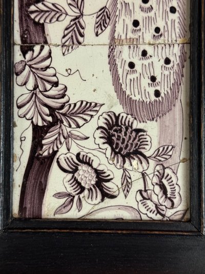 Three manganese Delft tiles forming a portrait of a peacock, 18th century