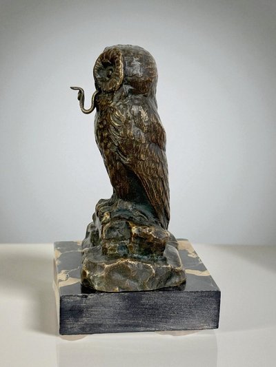 BRONZE WATCH HOLDER SIGNED H.RISCH DEPICTING AN OWL AND ITS SNAKE