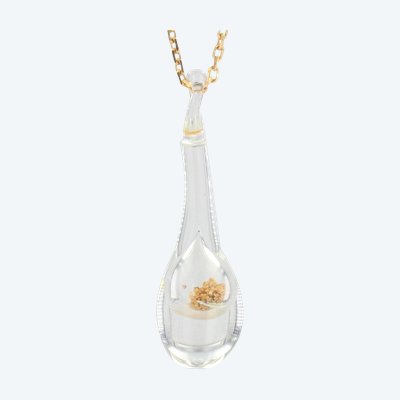 Gold Chain And Its Glass Pendant And Gold Glitter
