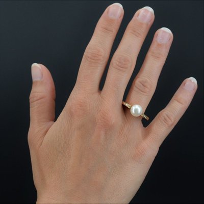 Anello piatto con perla e diamanti