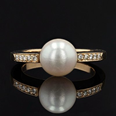Anello piatto con perla e diamanti
