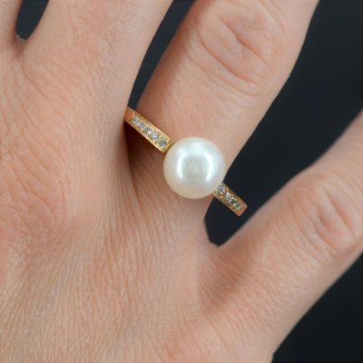 Anello piatto con perla e diamanti