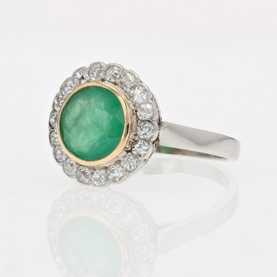 Anello antico con smeraldo e diamante rotondo