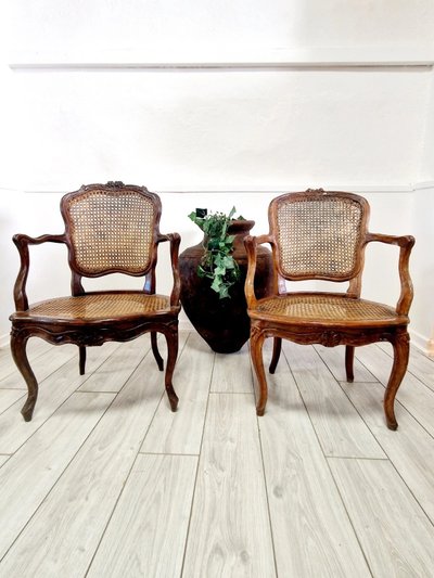 Antique French rattan armchairs from the Louis XVI period