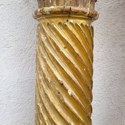 Pair of gilded and carved wood columns, 17th century