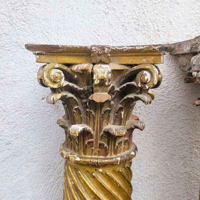 Pair of gilded and carved wood columns, 17th century