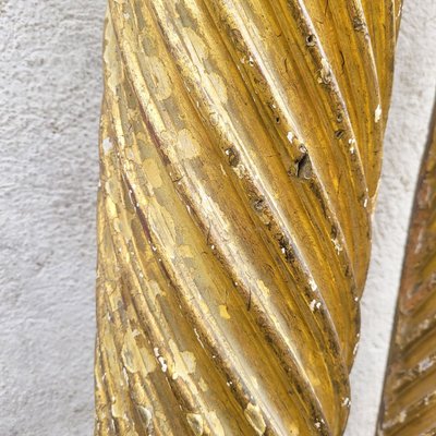 Pair of gilded and carved wood columns, 17th century
