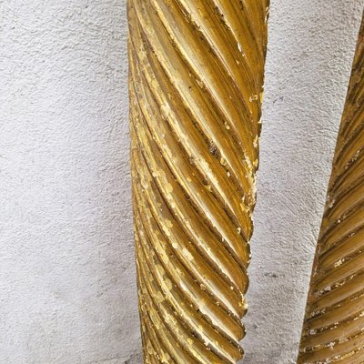 Pair of gilded and carved wood columns, 17th century