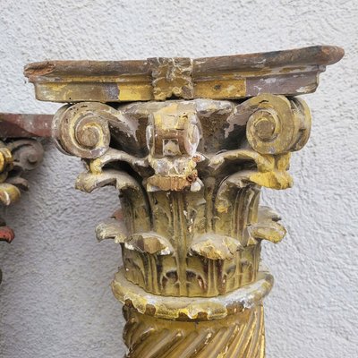 Pair of gilded and carved wood columns, 17th century