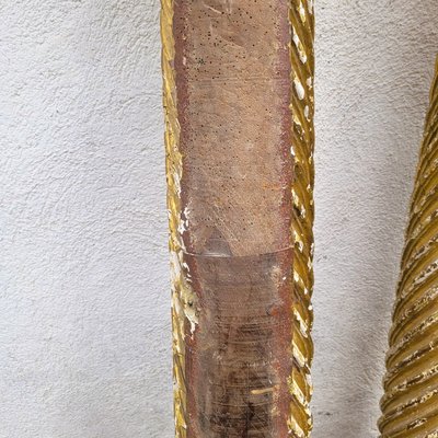 Pair of gilded and carved wood columns, 17th century