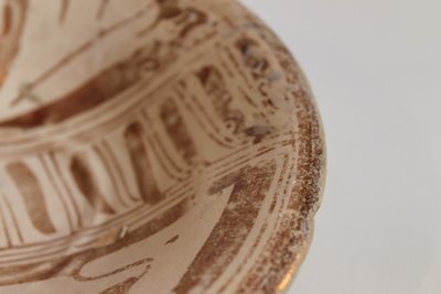 Small shallow dish in buff-glazed earthenware, Manisès, 16th century.