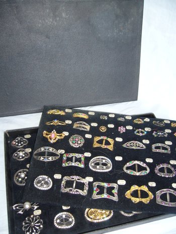 Box of decorative buckles from the early 20th century