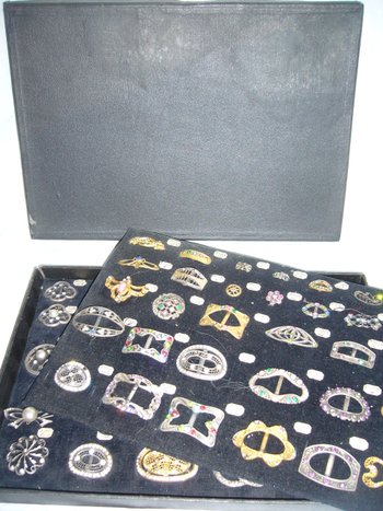 Box of decorative buckles from the early 20th century