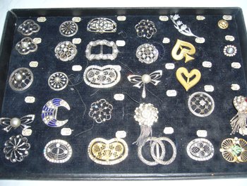 Box of decorative buckles from the early 20th century