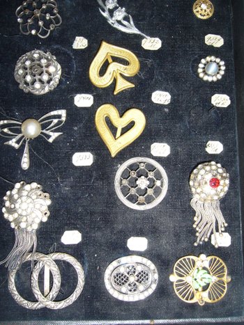 Box of decorative buckles from the early 20th century