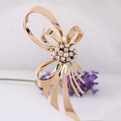 Spilla a fiocco vintage in oro rosa e diamanti