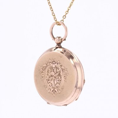 Montre ancienne de col or rose gravé