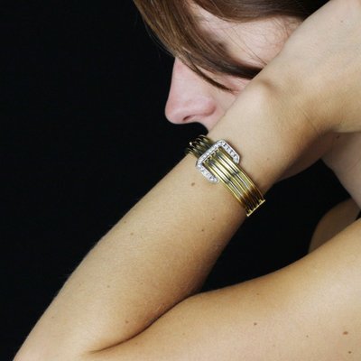 Bracelet jonc deux ors et sa boucle diamants
