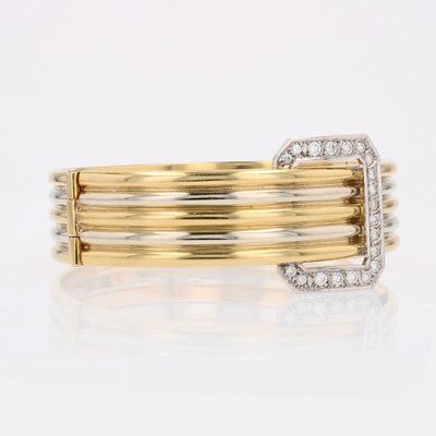 Bracelet jonc deux ors et sa boucle diamants