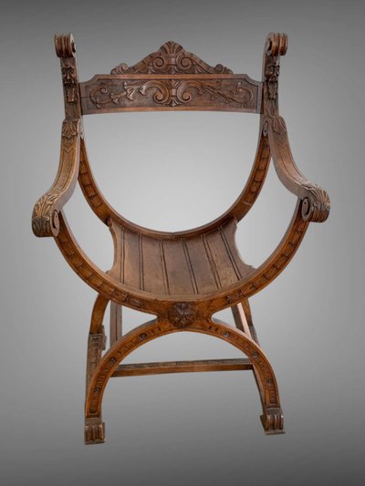 FAUTEUIL DIT " DAGOBERT " EN NOYER SCULPTÉ STYLE NEO- GOTHIQUE