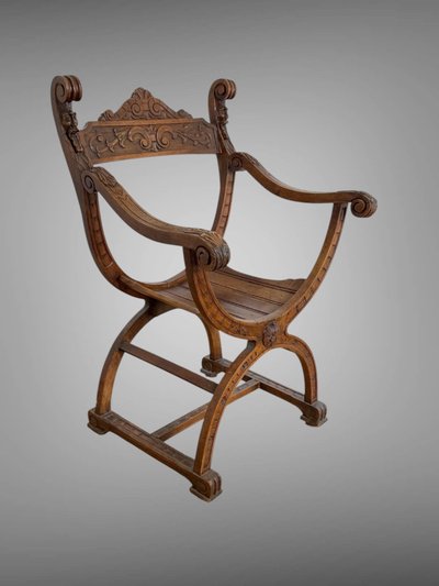 FAUTEUIL DIT " DAGOBERT " EN NOYER SCULPTÉ STYLE NEO- GOTHIQUE