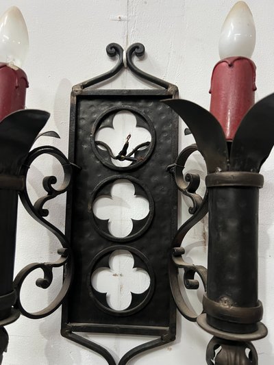 Set of three Renaissance-style wrought iron wall sconces, 20th century