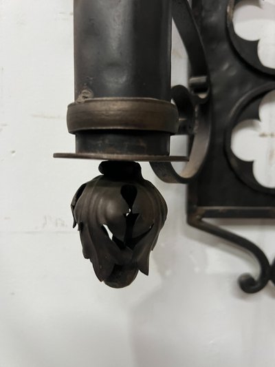Set of three Renaissance-style wrought iron wall sconces, 20th century