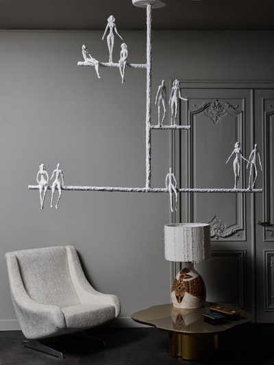 Linear chandelier with characters from Glustin Luminaires