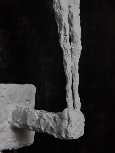 Wall lights with plaster characters from Glustin Luminaires