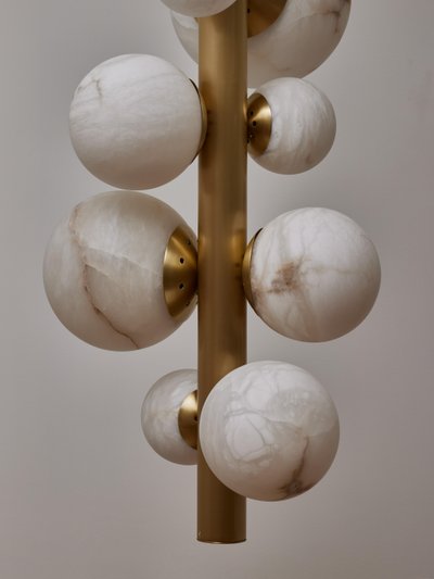 Vertical brass chandelier with alabaster globes