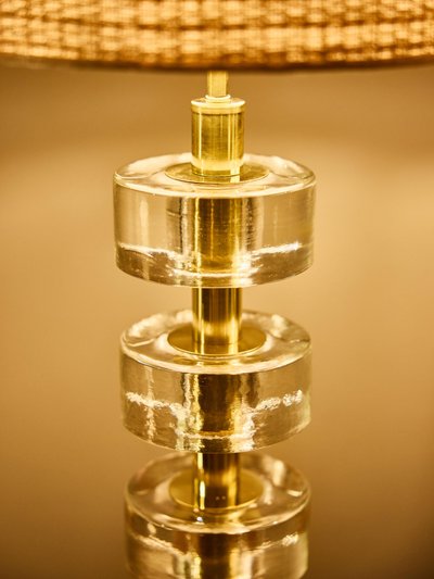 Pair of stacked solid glass disc table lamps with polished brass columns