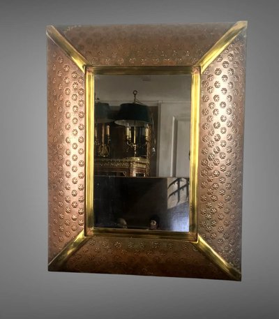 EMBOSSED COPPER AND BRASS MIRROR DECORATED WITH FLOWERS FROM THE 70S