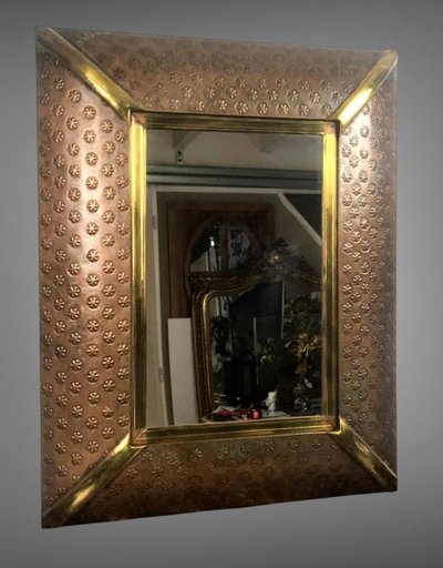 EMBOSSED COPPER AND BRASS MIRROR DECORATED WITH FLOWERS FROM THE 70S